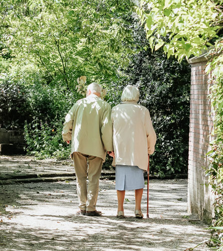 Elderly Couple Walking Together
